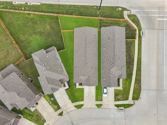 an aerial view of a house with a garden and plants