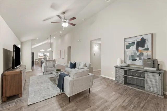 a living room with furniture and a flat screen tv