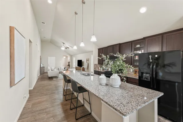 a kitchen with a table and chairs