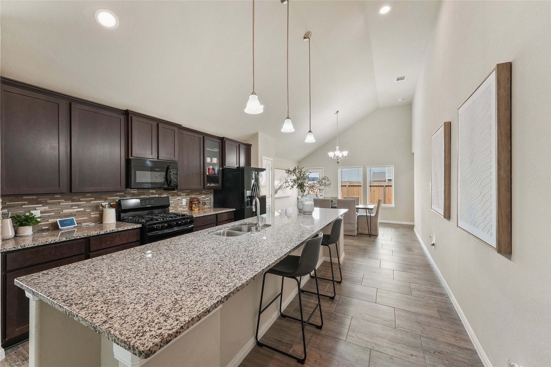 7911 Tuscan Cypress Drive Cypress, TX 77433 - Photo 7 of 27 a kitchen with stainless steel appliances granite countertop counter space a sink refrigerator and cabinets