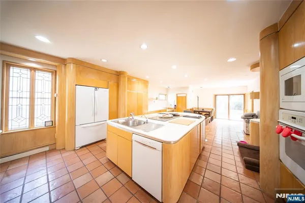 a kitchen that has a stove and a microwave