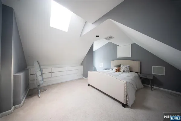 a bedroom with a bed and a cabinets