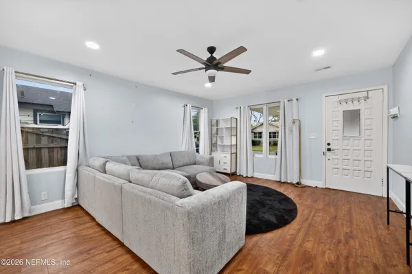 a living room with furniture and a window