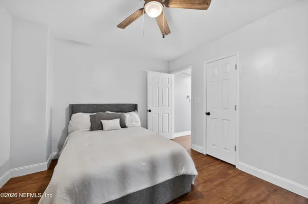 a large bed in a white room