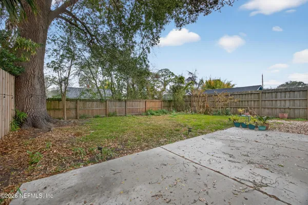 a view of a backyard with of the tree