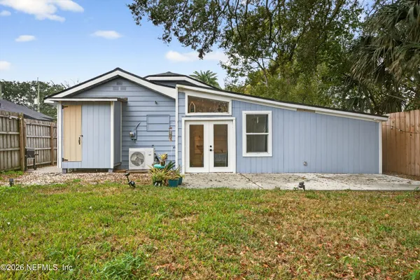 a house with trees in the background
