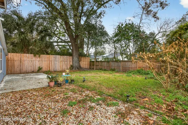 a backyard of a house with lots of green space