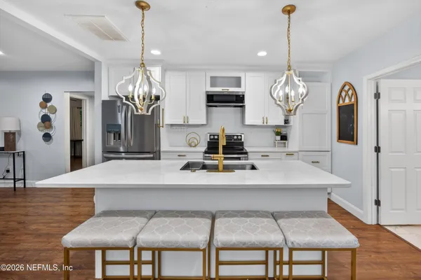 a view of a dining room and a chandelier