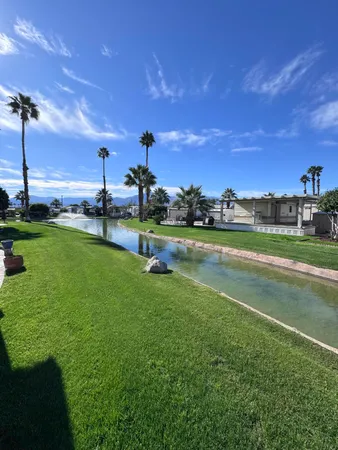 a view of a golf course with a lake