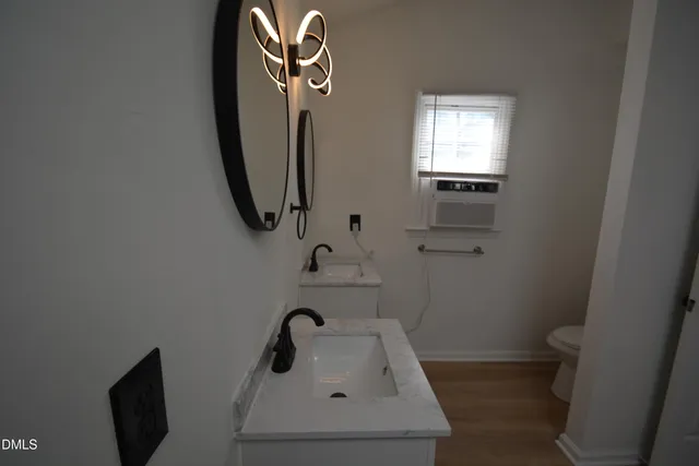 a bathroom with a sink and toilet