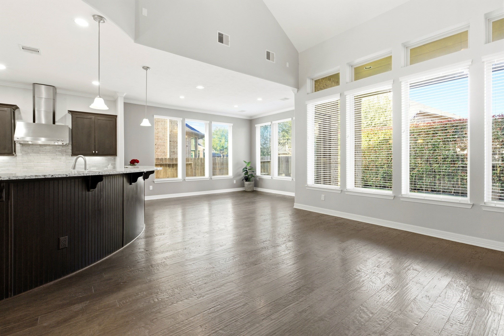 27834 Hunters Rock Lane Katy, TX 77494 - Photo 15 of 46 a view of a big room with wooden floor and windows