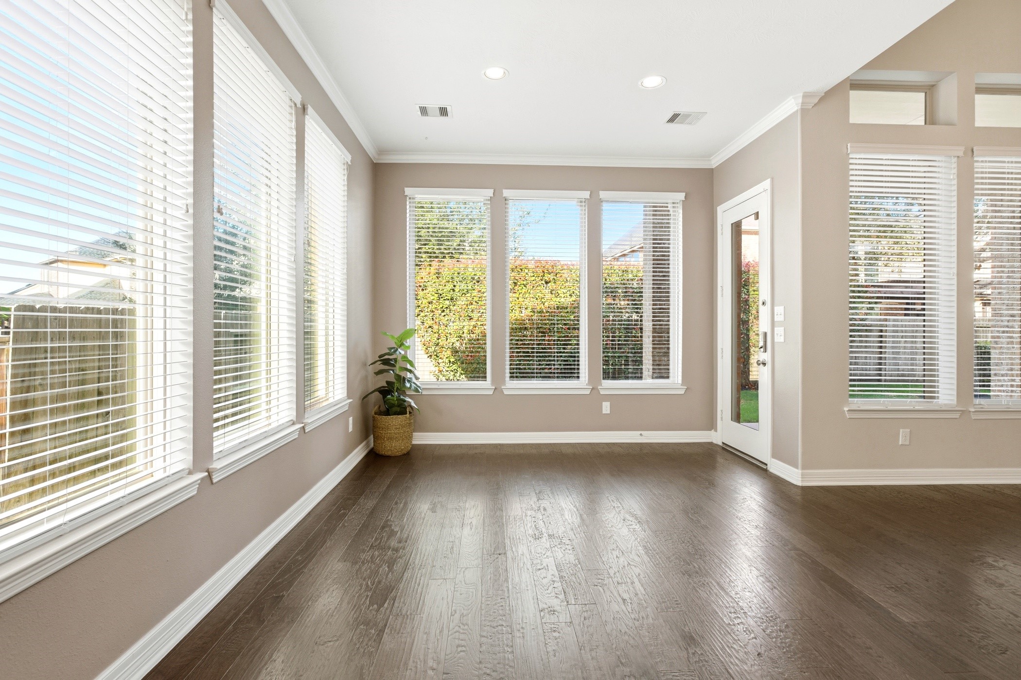 27834 Hunters Rock Lane Katy, TX 77494 - Photo 18 of 46 a view of an empty room with wooden floor and a window