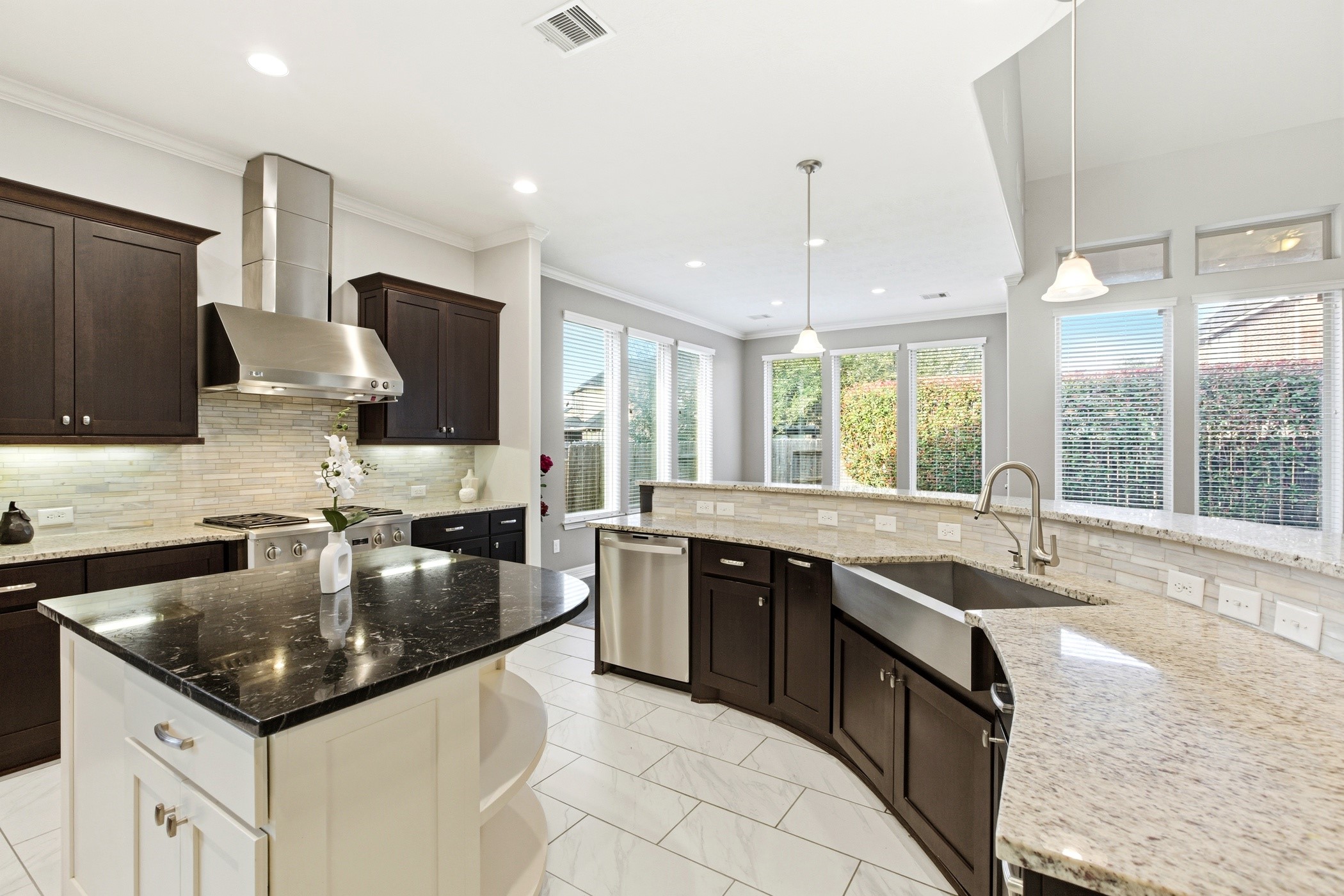 27834 Hunters Rock Lane Katy, TX 77494 - Photo 22 of 46 a kitchen with stainless steel appliances granite countertop a sink a stove and a wooden floors