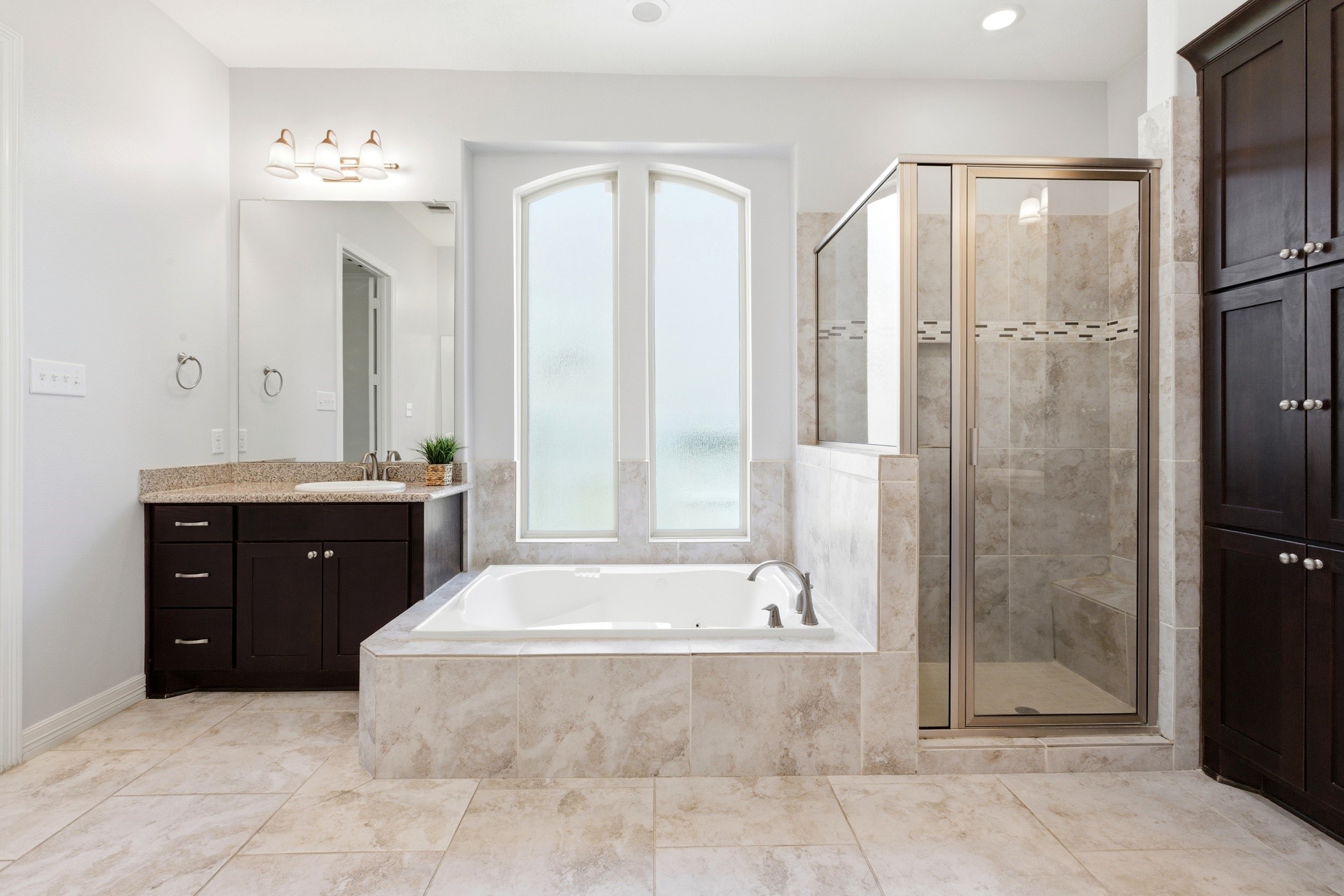 27834 Hunters Rock Lane Katy, TX 77494 - Photo 32 of 46 a spacious bathroom with a tub sink shower and mirror