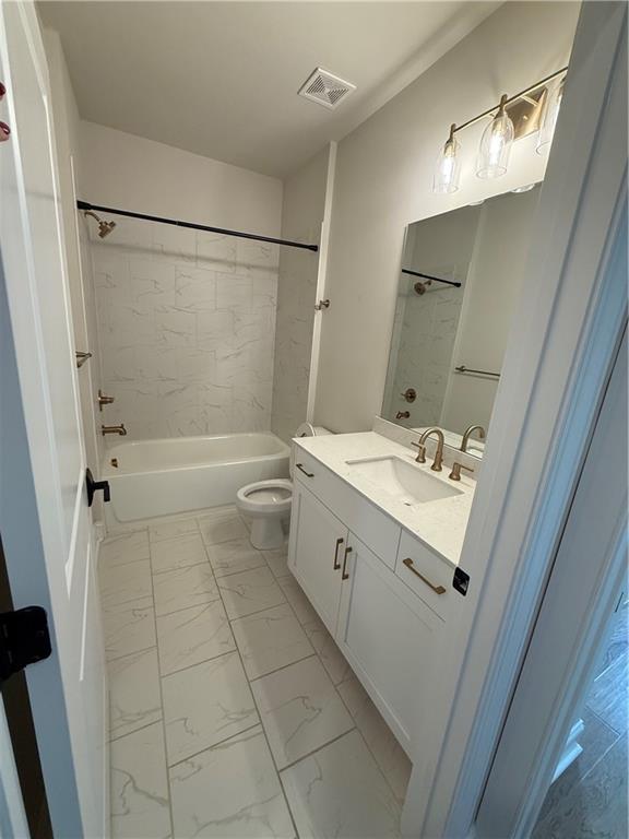 419 Duncan Dene Drive, Unit 140 Alpharetta, GA 30022 - Photo 12 of 22 a bathroom with a double vanity sink a toilet and shower