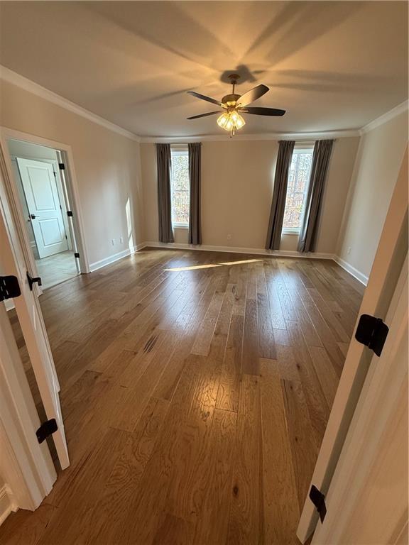 419 Duncan Dene Drive, Unit 140 Alpharetta, GA 30022 - Photo 14 of 22 wooden floor in an empty room with a window