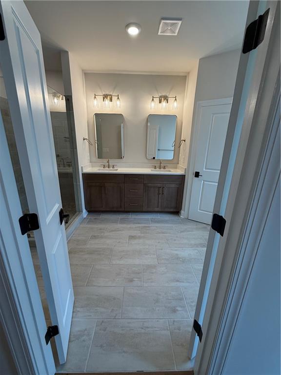 419 Duncan Dene Drive, Unit 140 Alpharetta, GA 30022 - Photo 15 of 22 a bathroom with sink and mirror