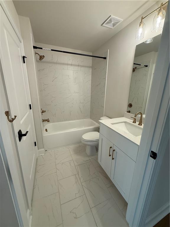 419 Duncan Dene Drive, Unit 140 Alpharetta, GA 30022 - Photo 20 of 22 a bathroom with a sink a toilet and shower