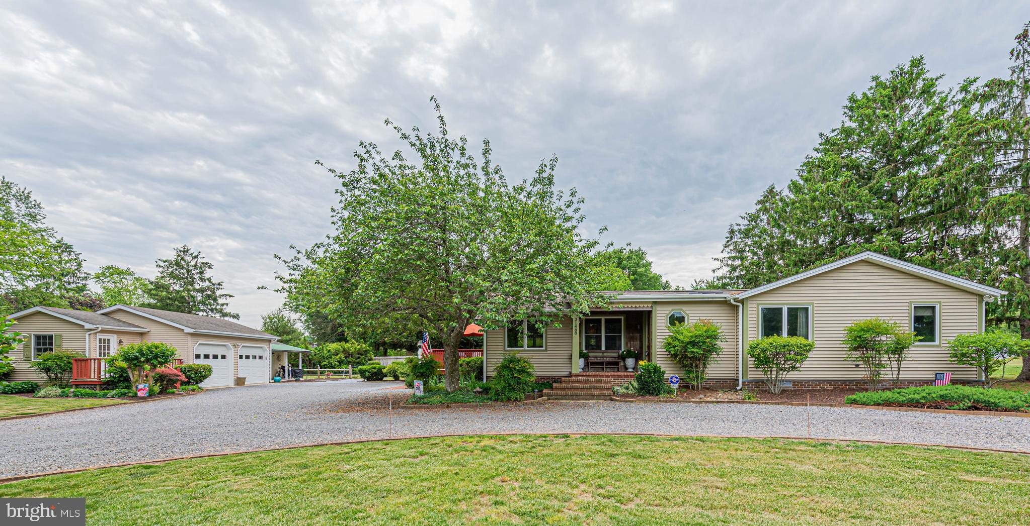 31468 Wingate Road Dagsboro, DE 19939 - Photo 1 of 48 a front view of house with yard and outdoor seating