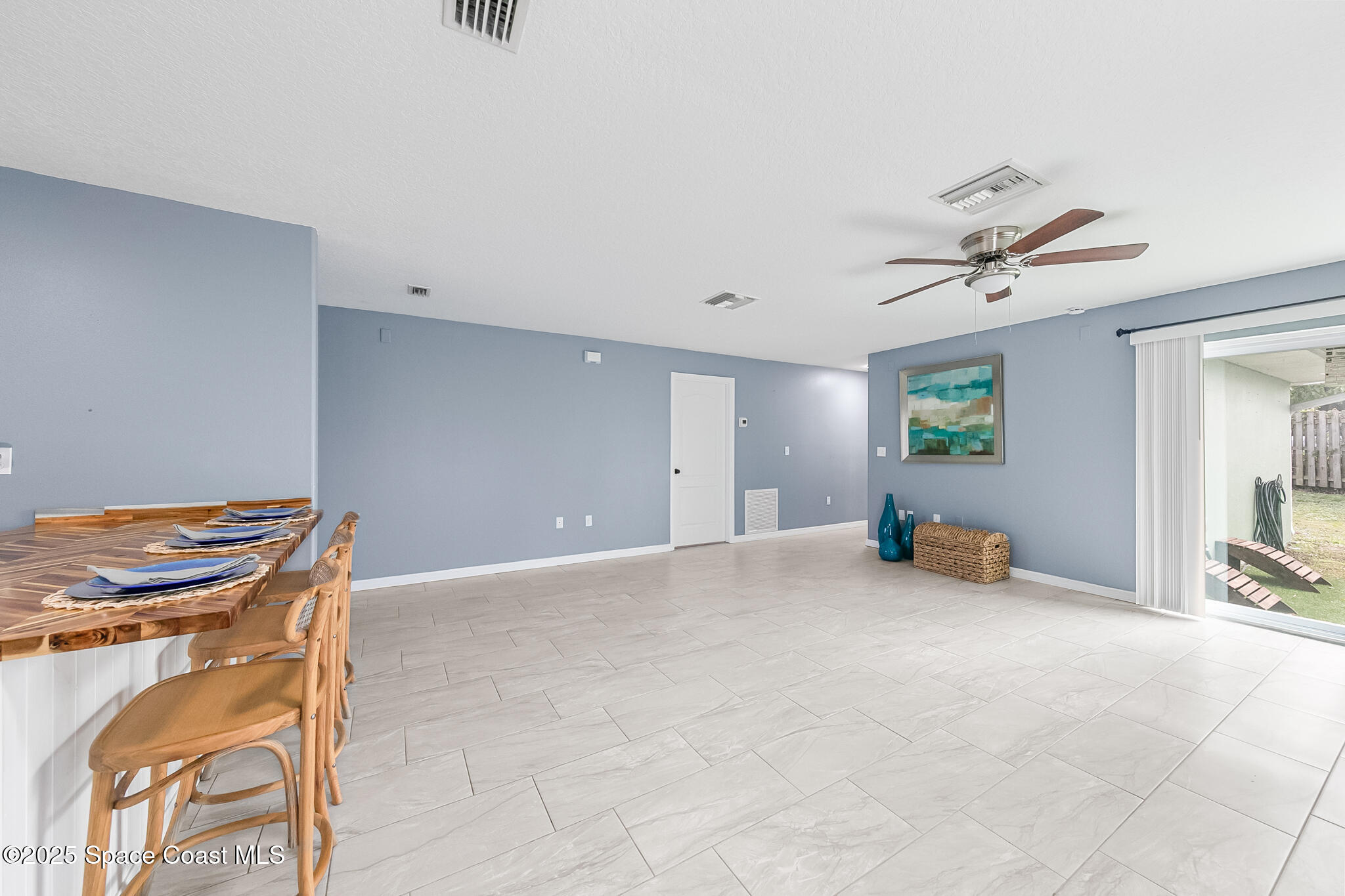 233 Broadview Drive Cocoa, FL 32922 - Photo 14 of 44 a view of a livingroom with a ceiling fan