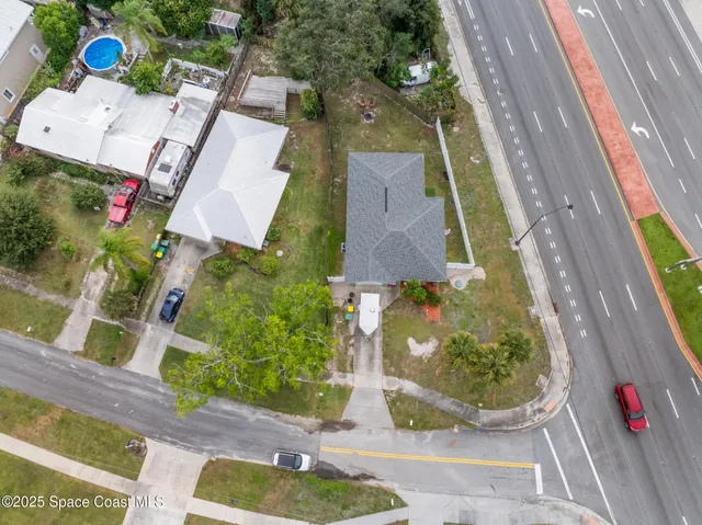 an aerial view of residential house with outdoor space