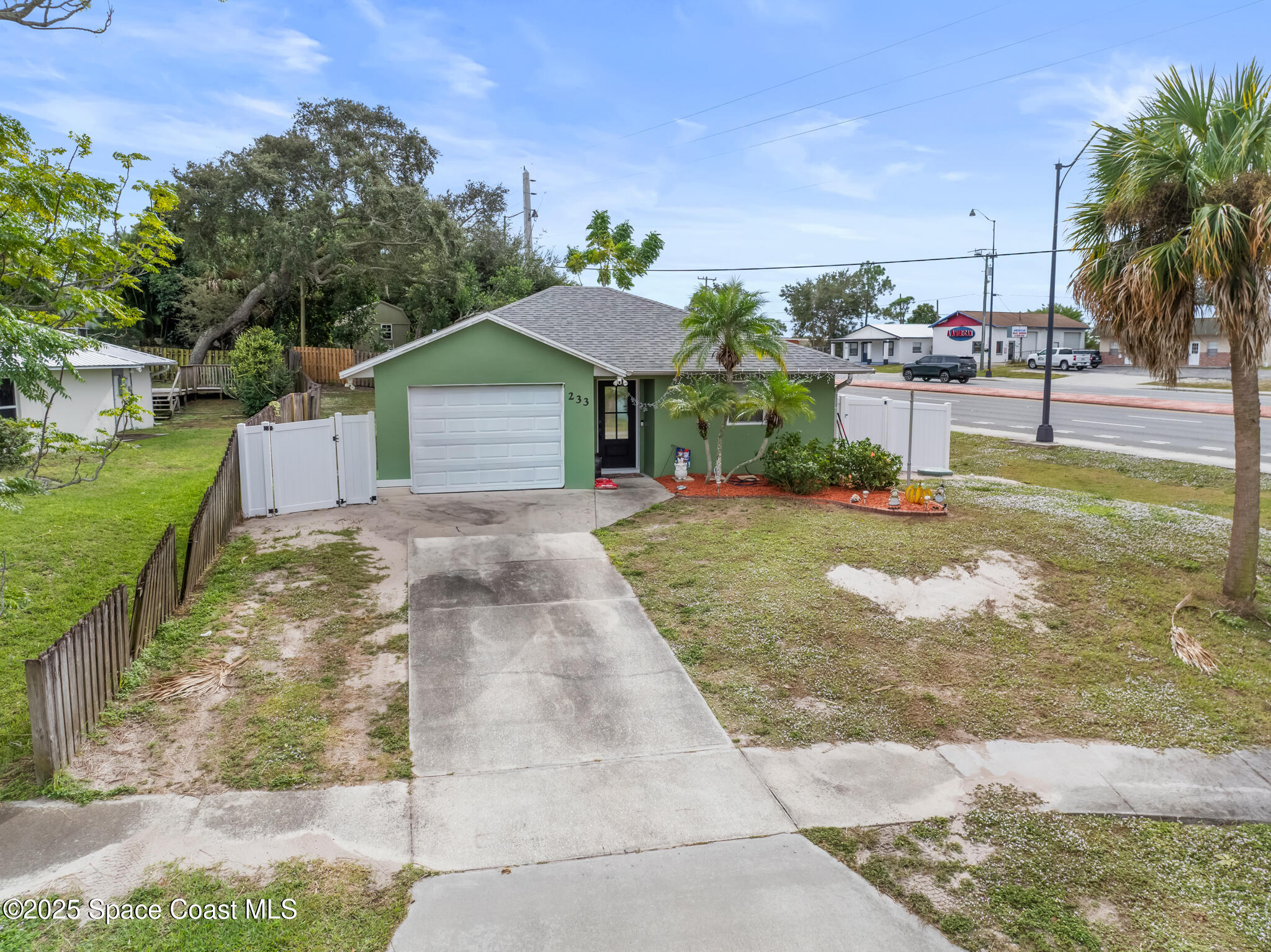 233 Broadview Drive Cocoa, FL 32922 - Photo 16 of 16 a view of a house with a yard and potted plants