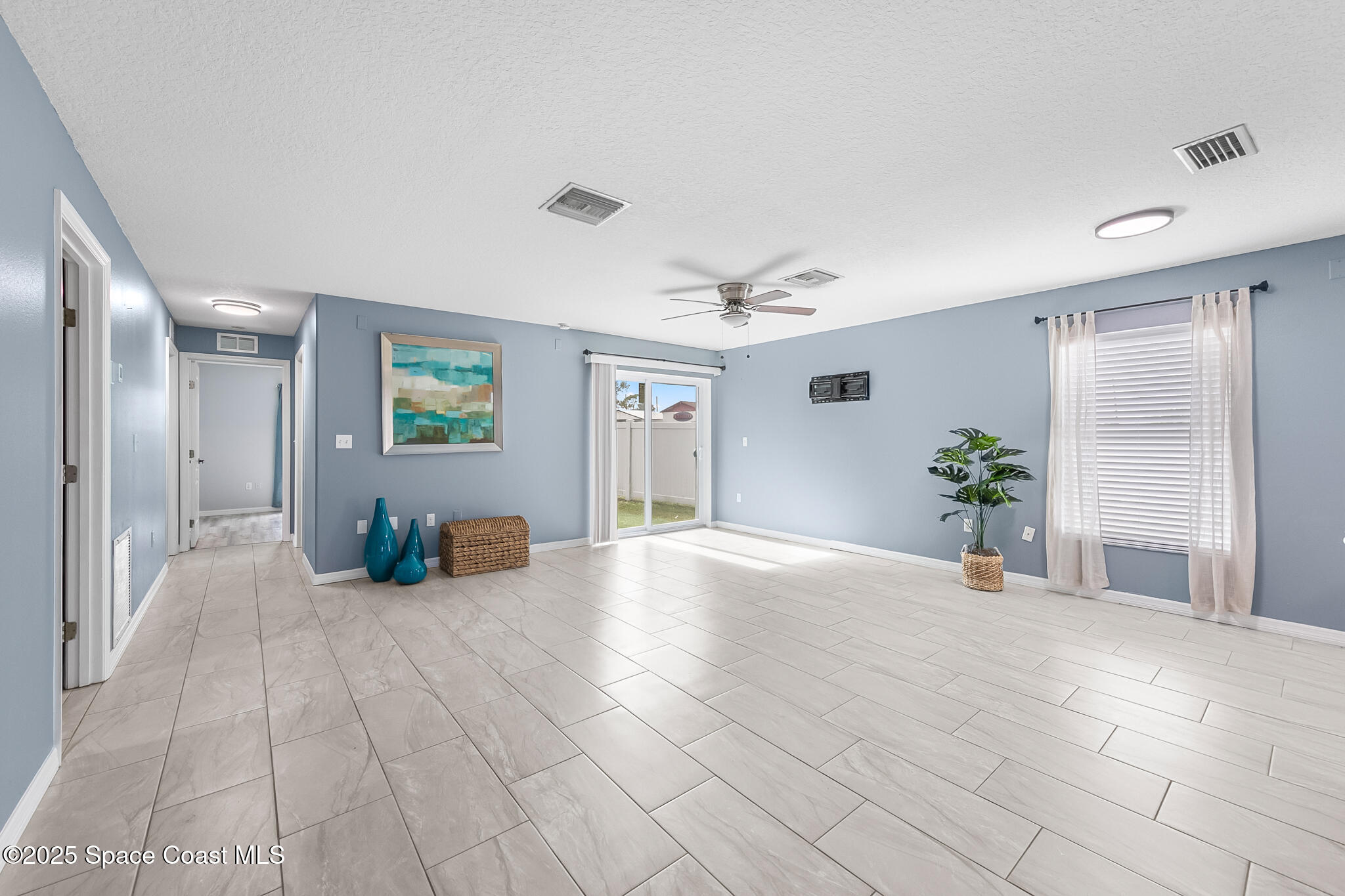 233 Broadview Drive Cocoa, FL 32922 - Photo 17 of 44 a view of a livingroom with furniture and a potted plant