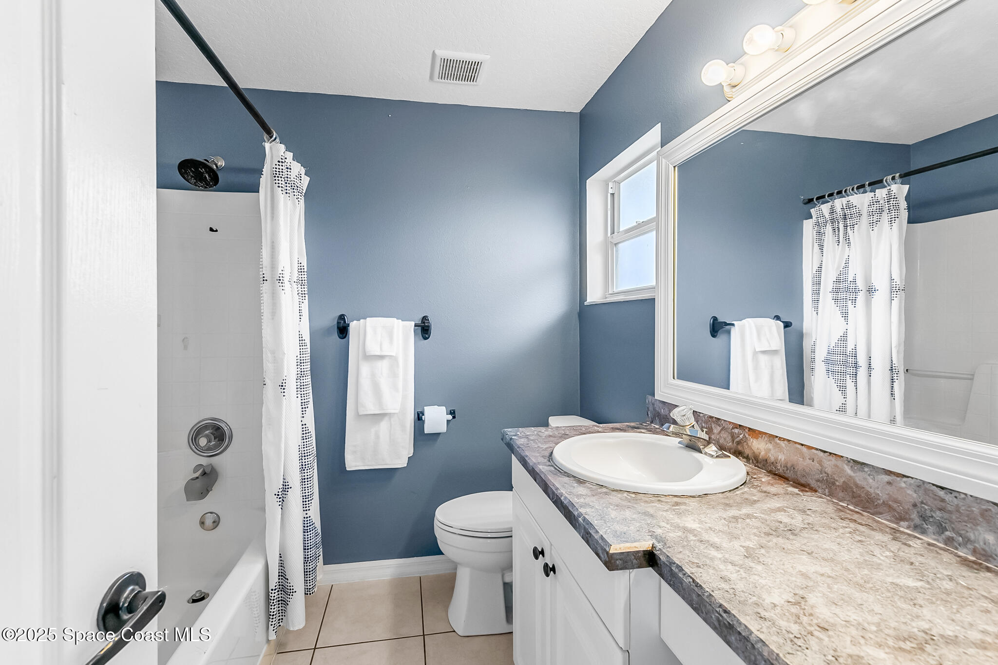 233 Broadview Drive Cocoa, FL 32922 - Photo 23 of 44 a bathroom with a granite countertop sink toilet and shower