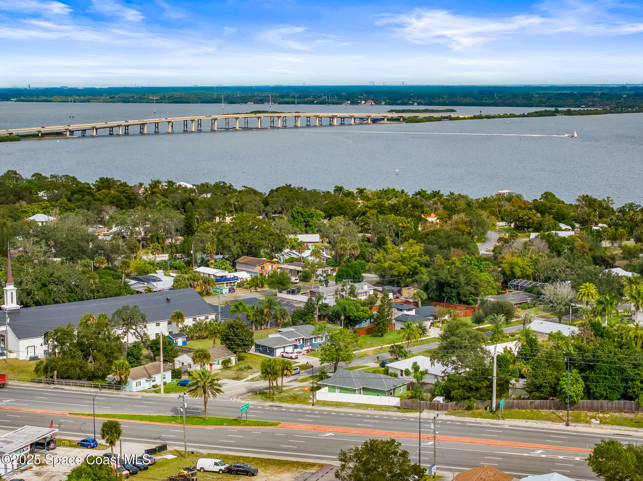 233 Broadview Drive Cocoa, FL 32922 - Photo 8 of 16 an aerial view of lake and houses with outdoor space