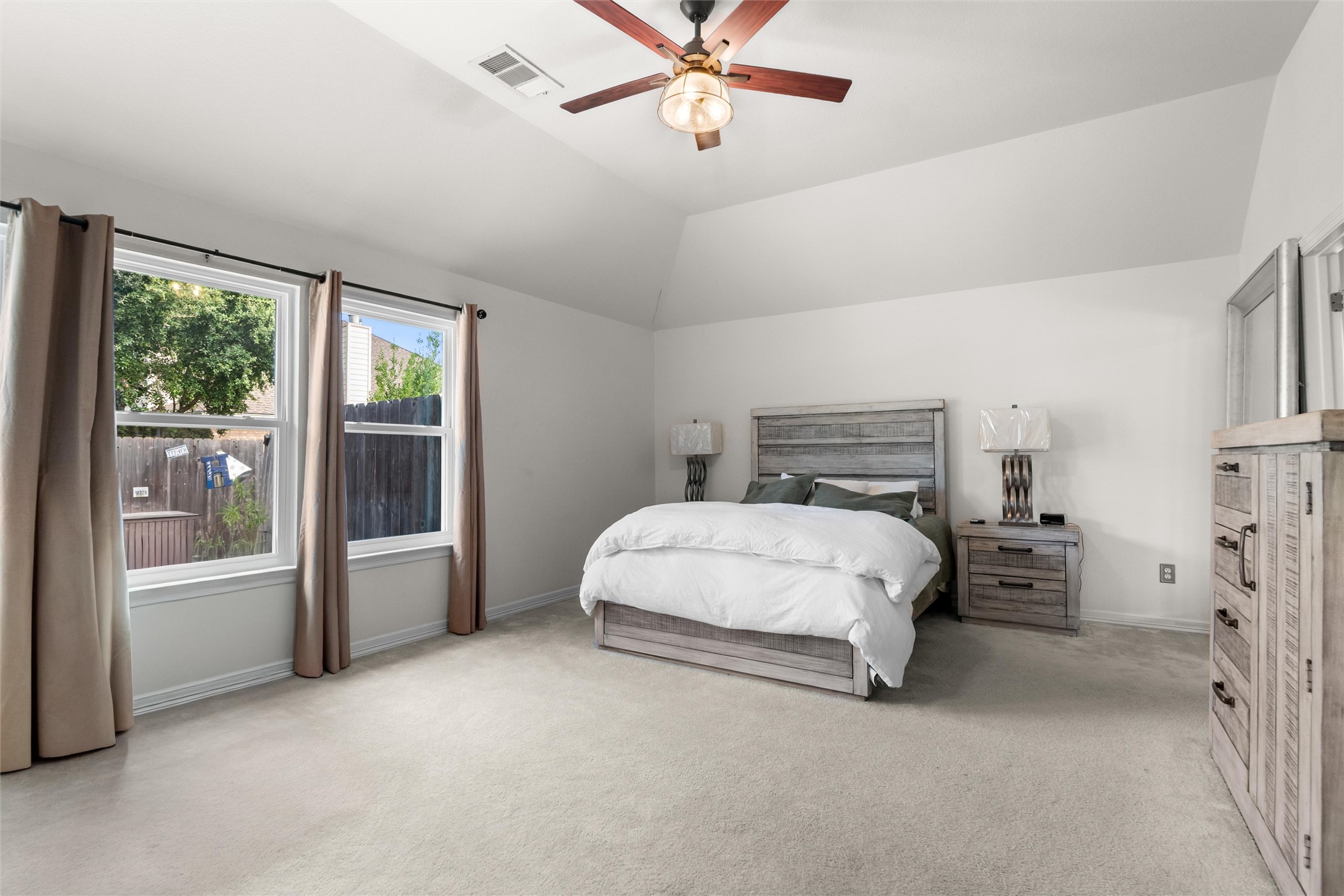 20704 Windmill Ridge Street Pflugerville, TX 78660 - Photo 16 of 34 A restful bedroom offers comfort with soft carpeting and a vaulted ceiling.