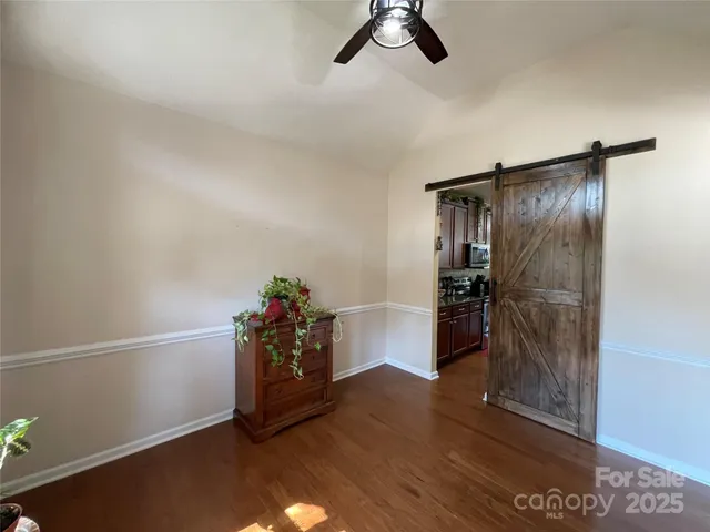 a kitchen with a refrigerator and microwave