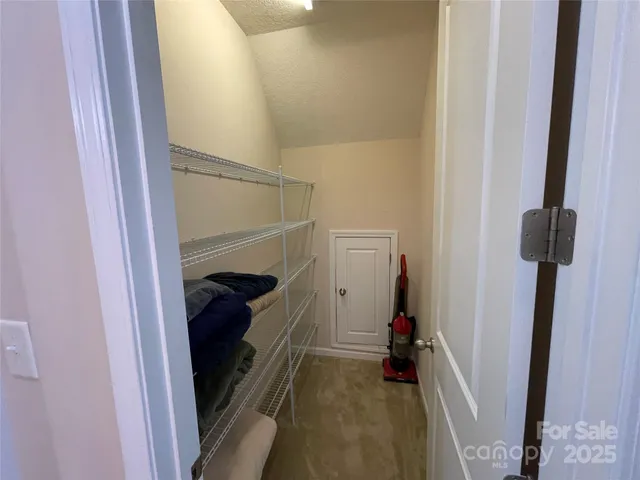 a view of hallway with walk in closet