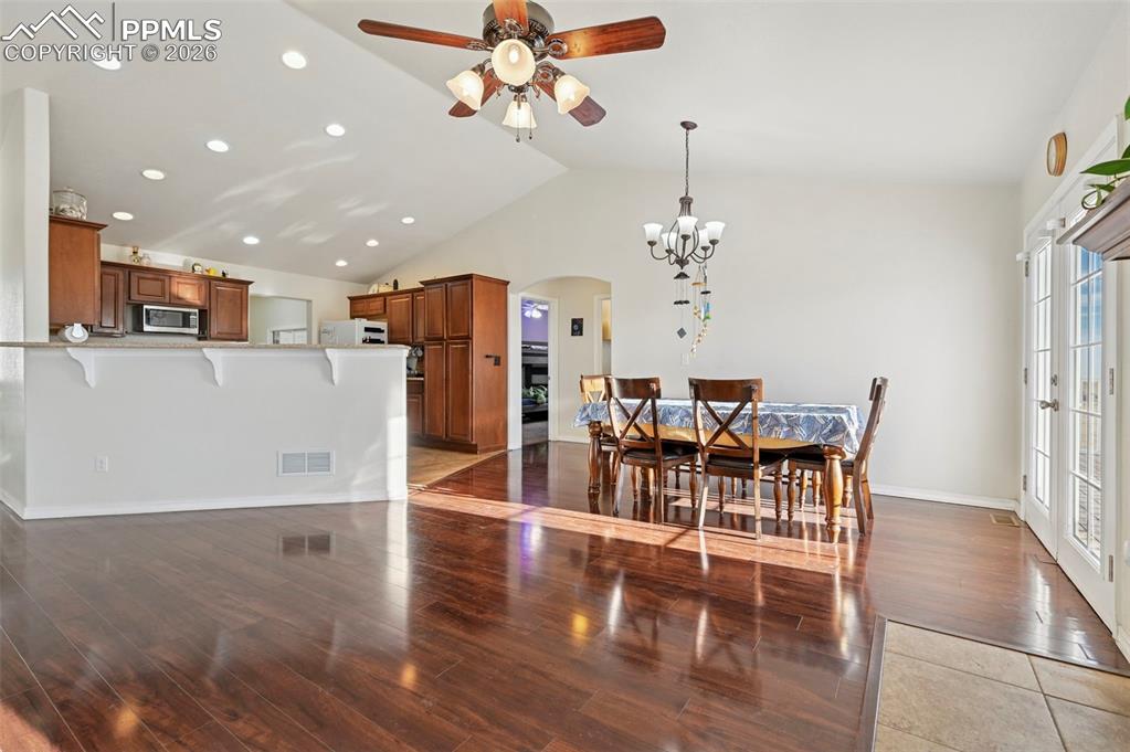 16575 Cathys Loop Peyton, CO 80831 - Photo 11 of 49 a view of a dining room with furniture and wooden floor