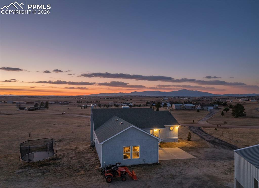 16575 Cathys Loop Peyton, CO 80831 - Photo 2 of 49 a view of an ocean and beach