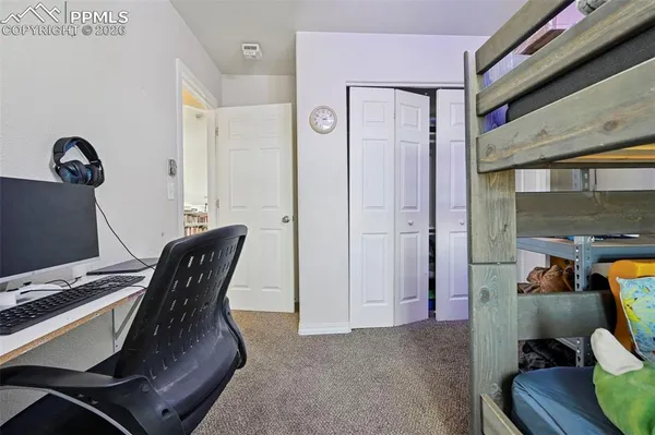 a view of a workspace with furniture and bedroom