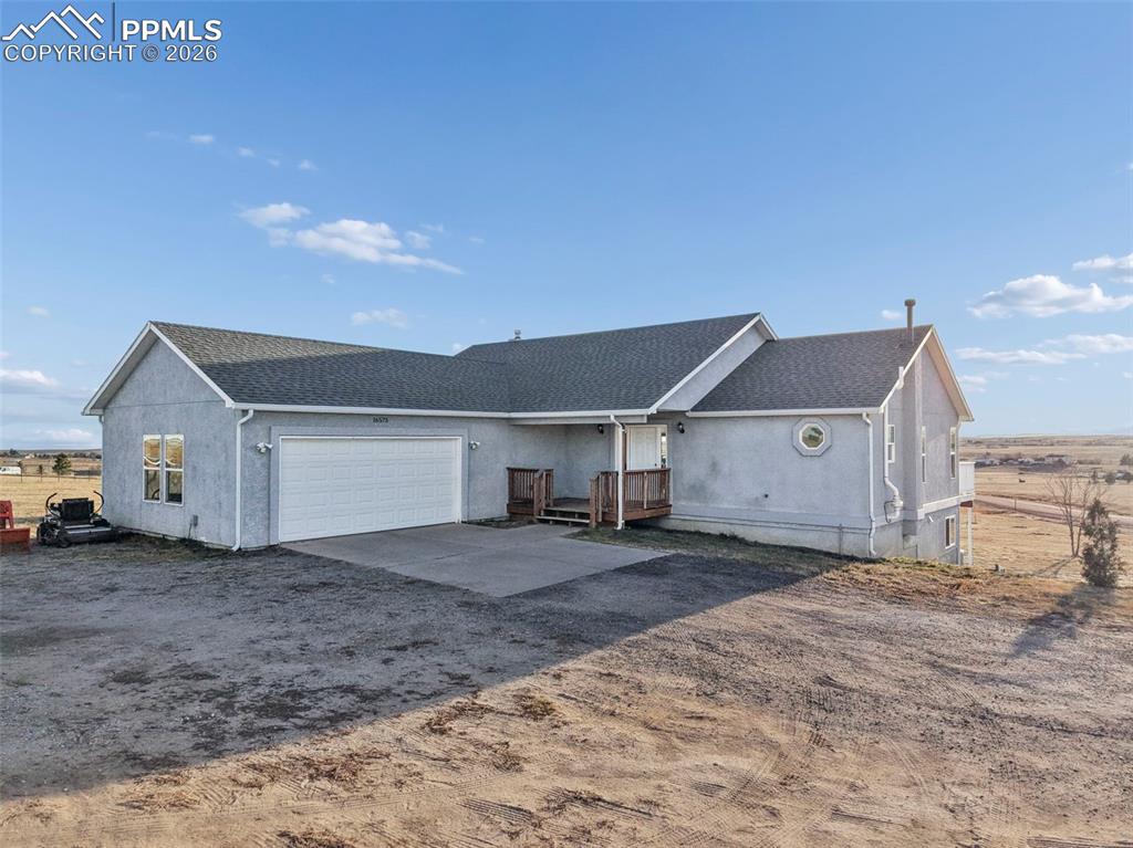 16575 Cathys Loop Peyton, CO 80831 - Photo 3 of 49 a view of a house with a yard
