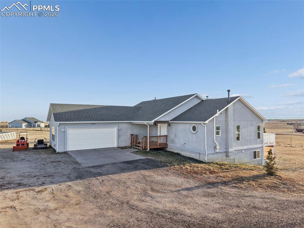 16575 Cathys Loop Peyton, CO 80831 - Photo 5 of 49 a view of a house with a yard