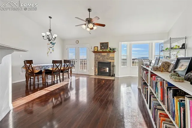 a living room with fireplace furniture and a book shelf
