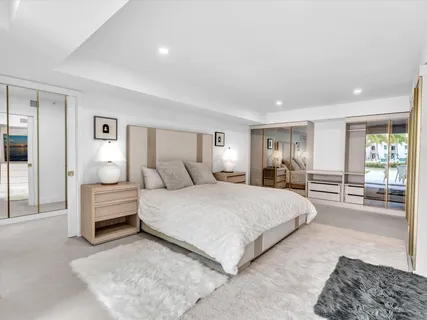 a spacious bedroom with a bed and window