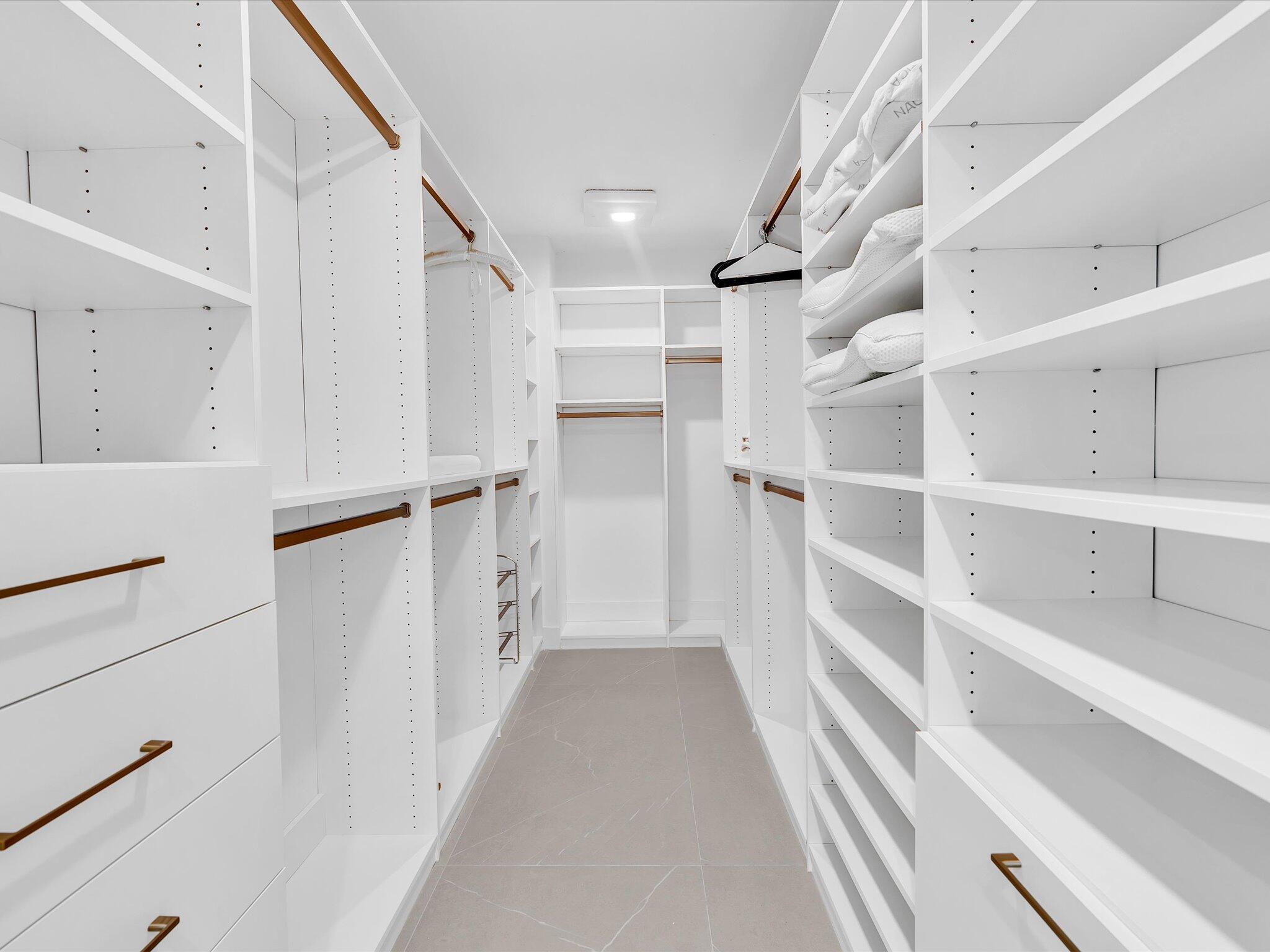 120 Southeast 5th Avenue, Unit 225 Boca Raton, FL 33432 - Photo 16 of 42 a view of walk in closet with empty racks