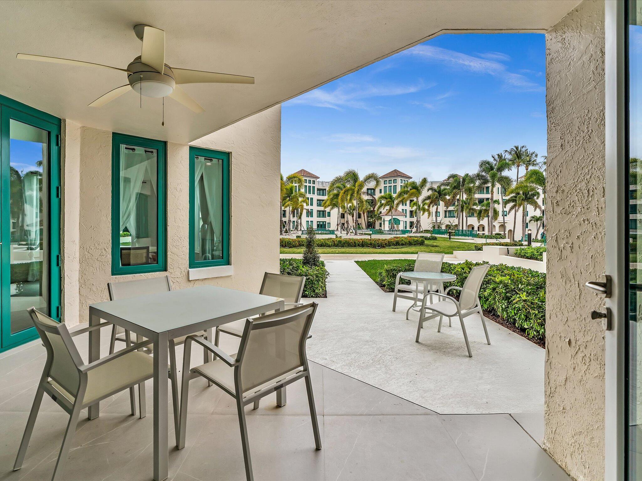 120 Southeast 5th Avenue, Unit 225 Boca Raton, FL 33432 - Photo 18 of 42 a dining room with furniture and a floor to ceiling window