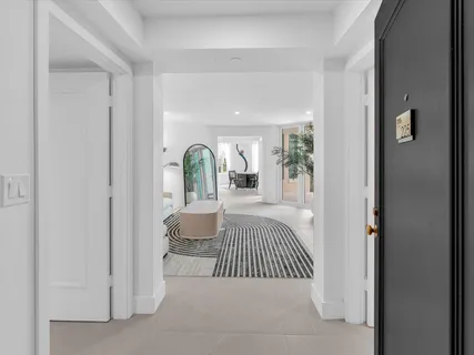 a bedroom with a bed and a mirror