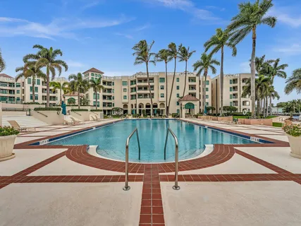 a swimming pool with outdoor seating and yard