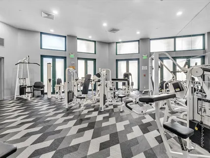 a very nice looking living room with lots of furniture and windows