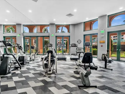 a view of a livingroom with workspace and a window