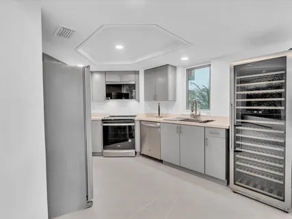 a kitchen with a refrigerator stove and microwave