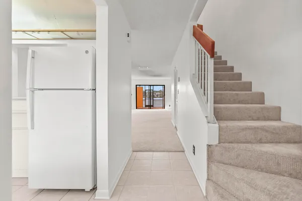 a view of staircase with white walls