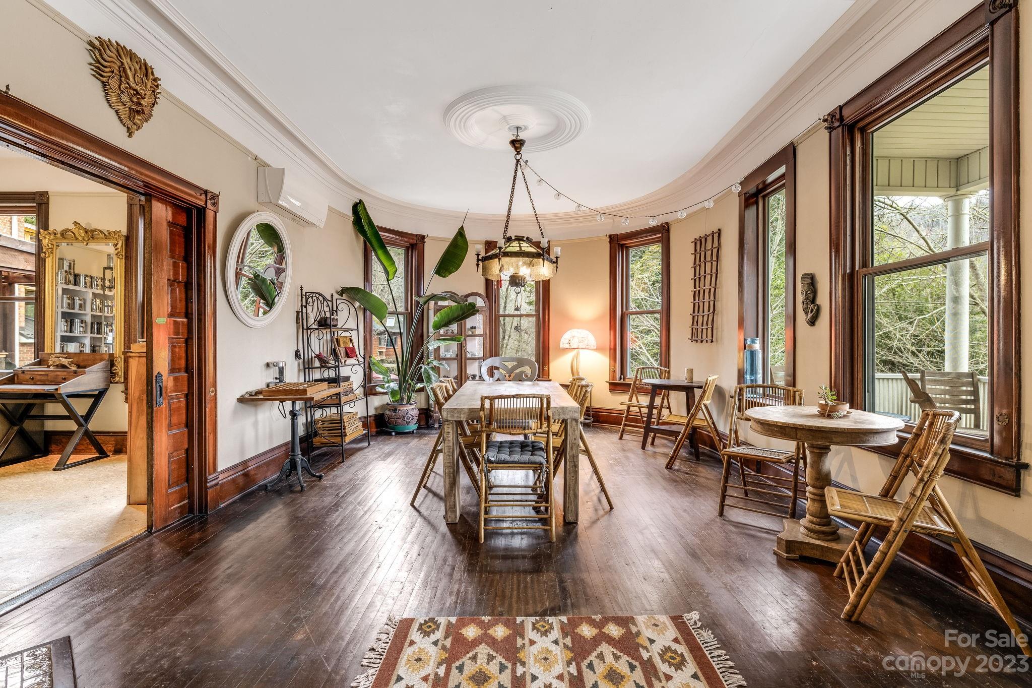 2412 Stackhouse Road Marshall, NC 28753 - Photo 12 of 48 a living room with furniture two window and wooden floor
