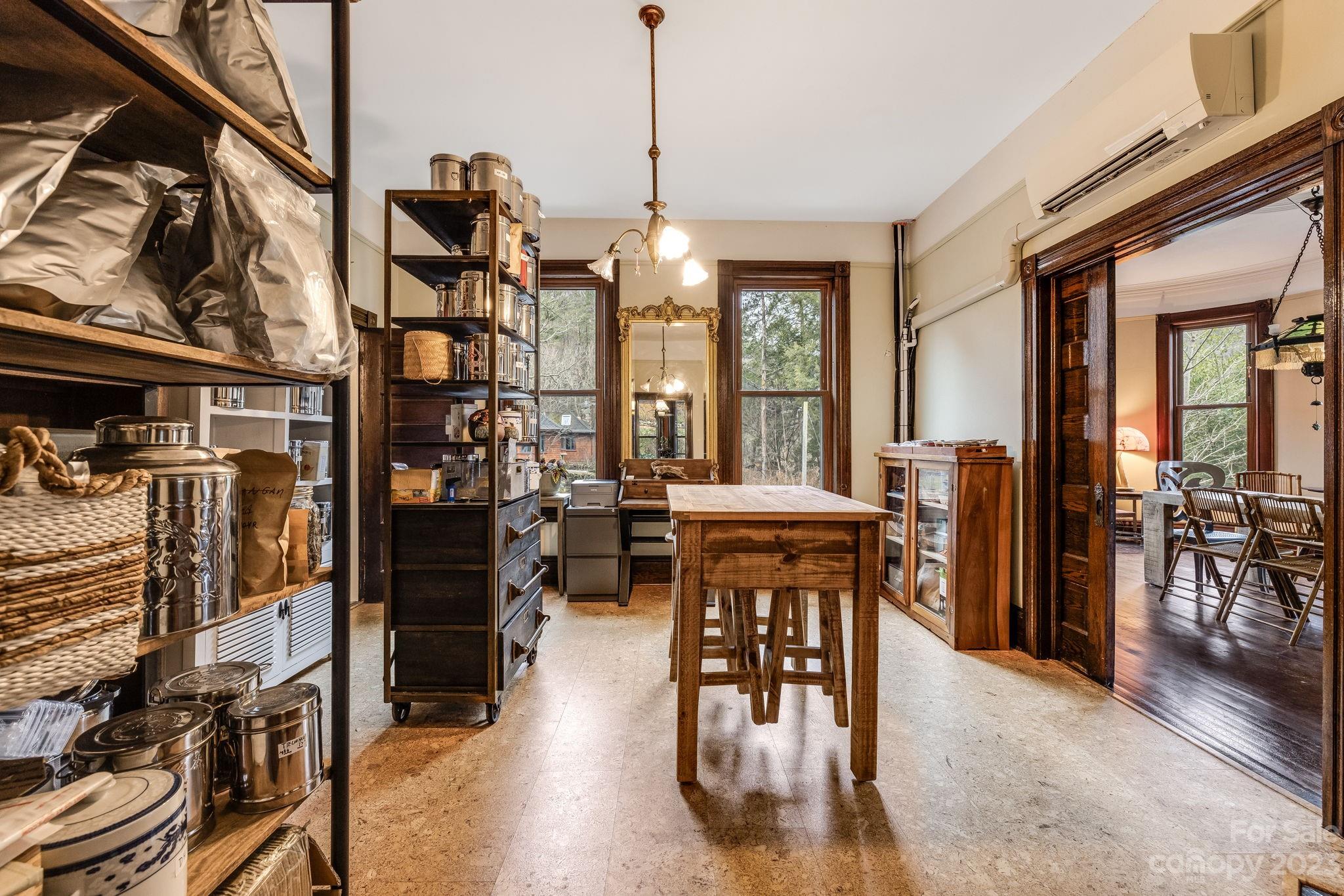 2412 Stackhouse Road Marshall, NC 28753 - Photo 14 of 48 a view of a dining room with furniture window and wooden floor