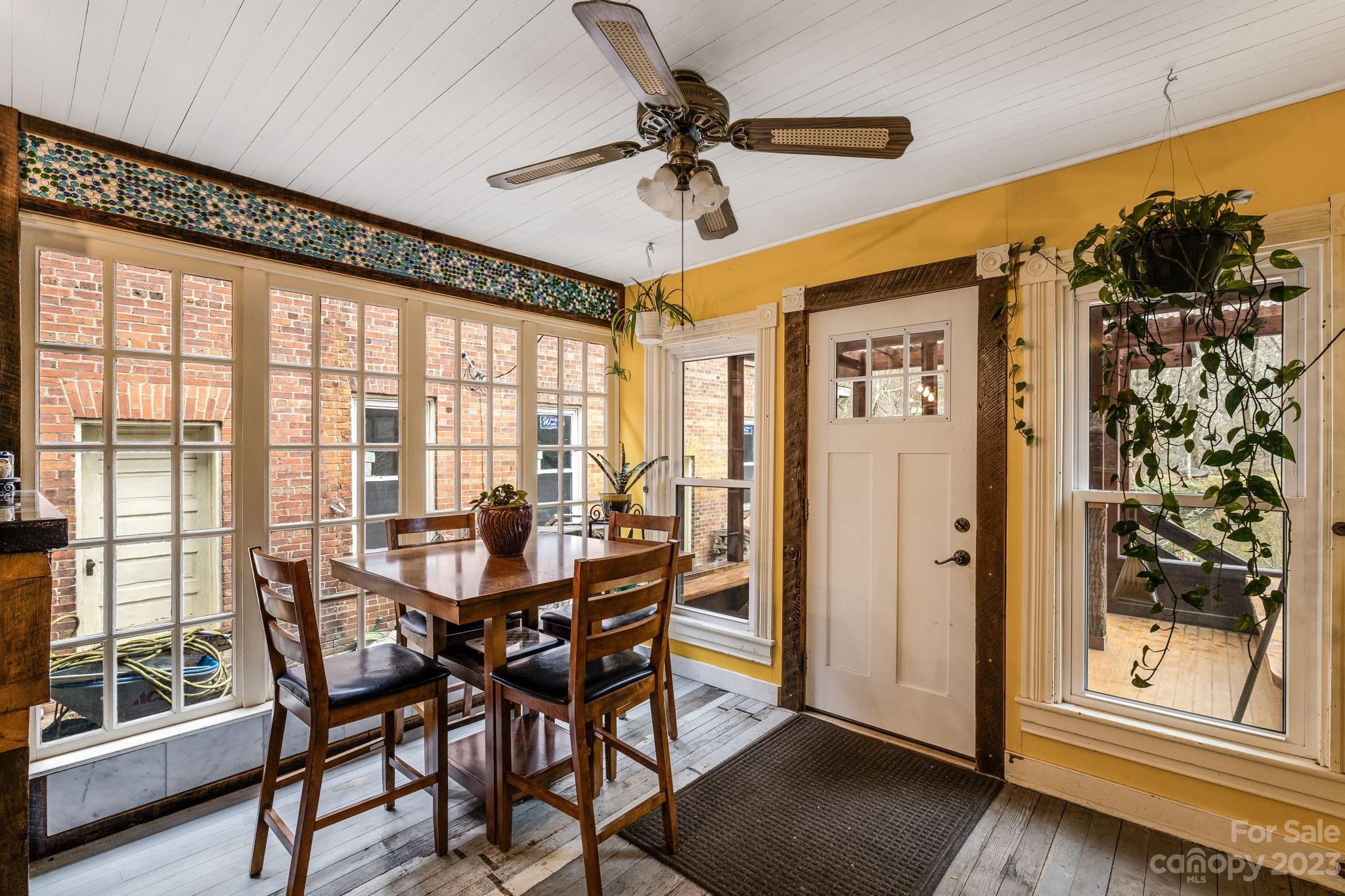 2412 Stackhouse Road Marshall, NC 28753 - Photo 19 of 48 a view of a dining room with furniture window and outside view